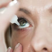 woman putting drops into eyes, dry eye treatment Springfield MA, dry eye treatment East Longmeadow MA, eye doctor Hampden MA